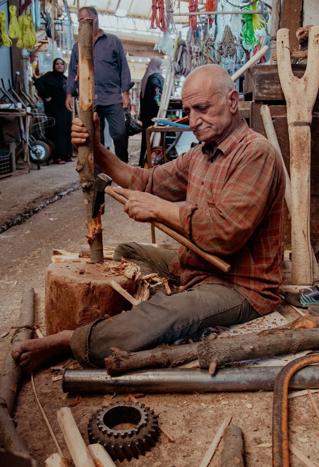 elderly man working with wood